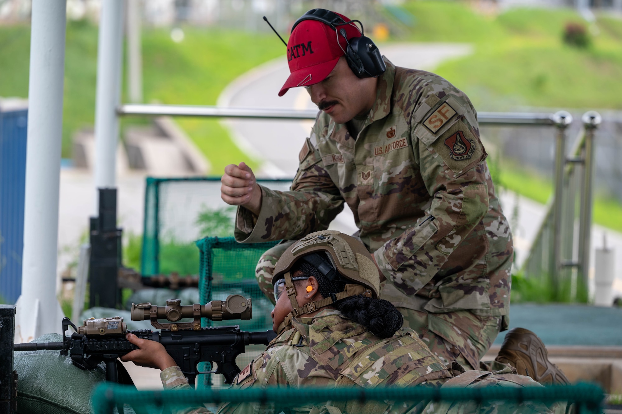 U.S. Air Force Tech. Sgt. Alec Kennedy, 8th Security Forces Squadron combat arms training and maintenance section chief, provides individual feedback during the defender weapon trainer class at a Republic of Korea Army shooting range, ROK, May 27, 2026. This initiative marked the first time the unit utilized 8th SFS defenders, rather than combat arms specialists, as the primary instructors. (U.S. Air Force photo by Staff Sgt. Cedrique Oldaker)