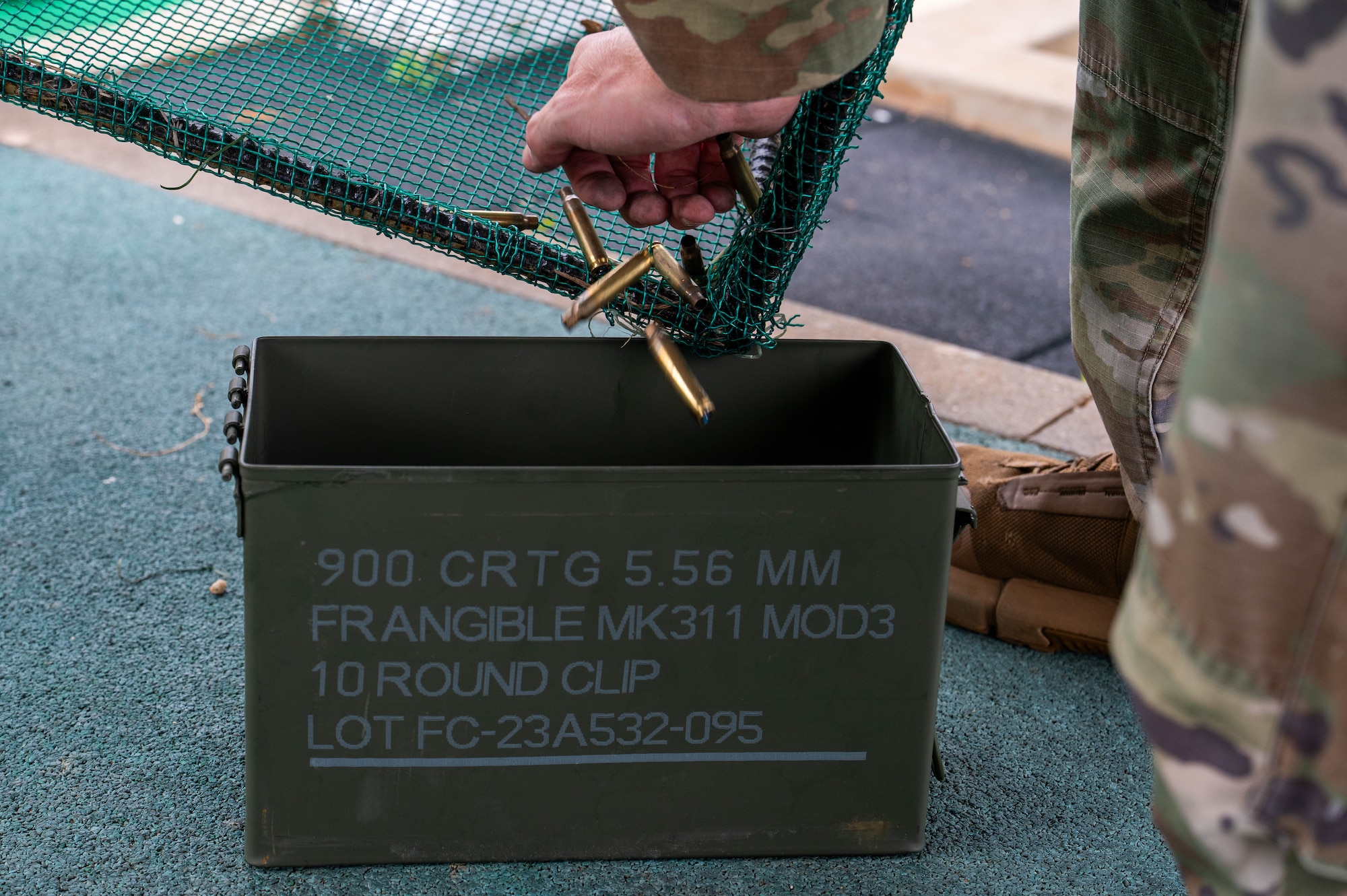 A U.S. Air Force Airman assigned to the 8th Security Forces Squadron collects spent casings during the defender weapon trainer course at a Republic of Korea shooting range, ROK, May 27, 2026. The course is designed to decentralize training authority, dispersing instructor capabilities across the entire squadron rather than concentrating it solely within a specialized flight. (U.S. Air Force photo by Staff Sgt. Cedrique Oldaker)