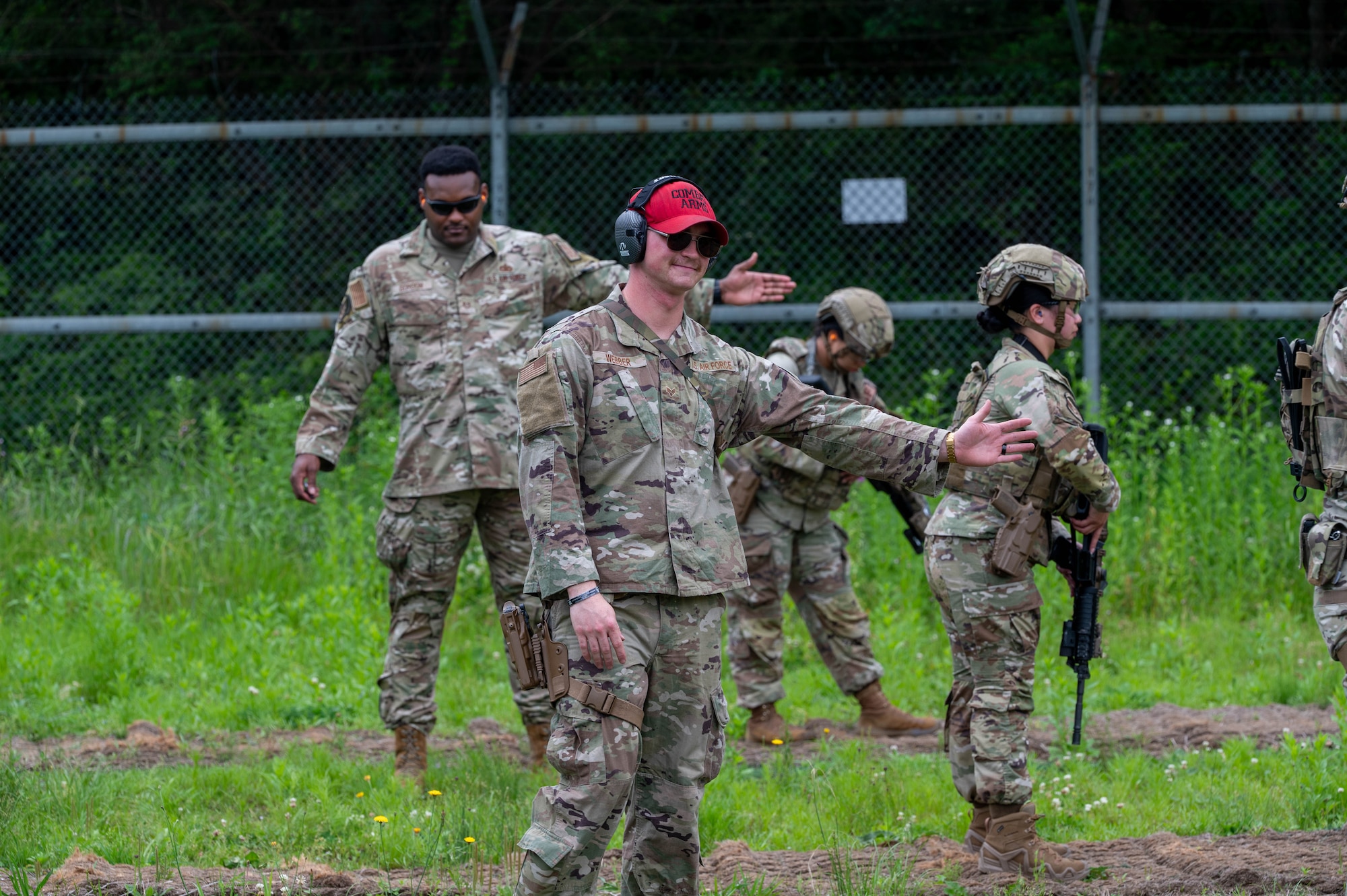 U.S. Air Force Senior Airman Gregory Webber, 8th Security Forces Squadron combat arms training and maintenance instructor, front, and U.S. Air Force Tech. Sgt. Shelby Gordon, 8th Security Forces Squadron defender weapon trainer, back, declare the shooting range safe during the defender weapon trainer course at a Republic of Korea shooting range, ROK, May 27, 2026. The course is designed to decentralize training authority, dispersing instructor capabilities across the entire squadron rather than concentrating it solely within a specialized flight. (U.S. Air Force photo by Staff Sgt. Cedrique Oldaker)