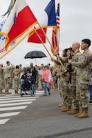 World War II veterans and guests sing the United States national anthem during an arrival event at the Deauville-Normandy Airport in Normandy, France, June 3, 2026. Veterans traveled to Normandy to participate in commemorative events honoring the 82nd anniversary of D-Day. (U.S. Army photo by Sgt. 1st Class Christopher Osburn)