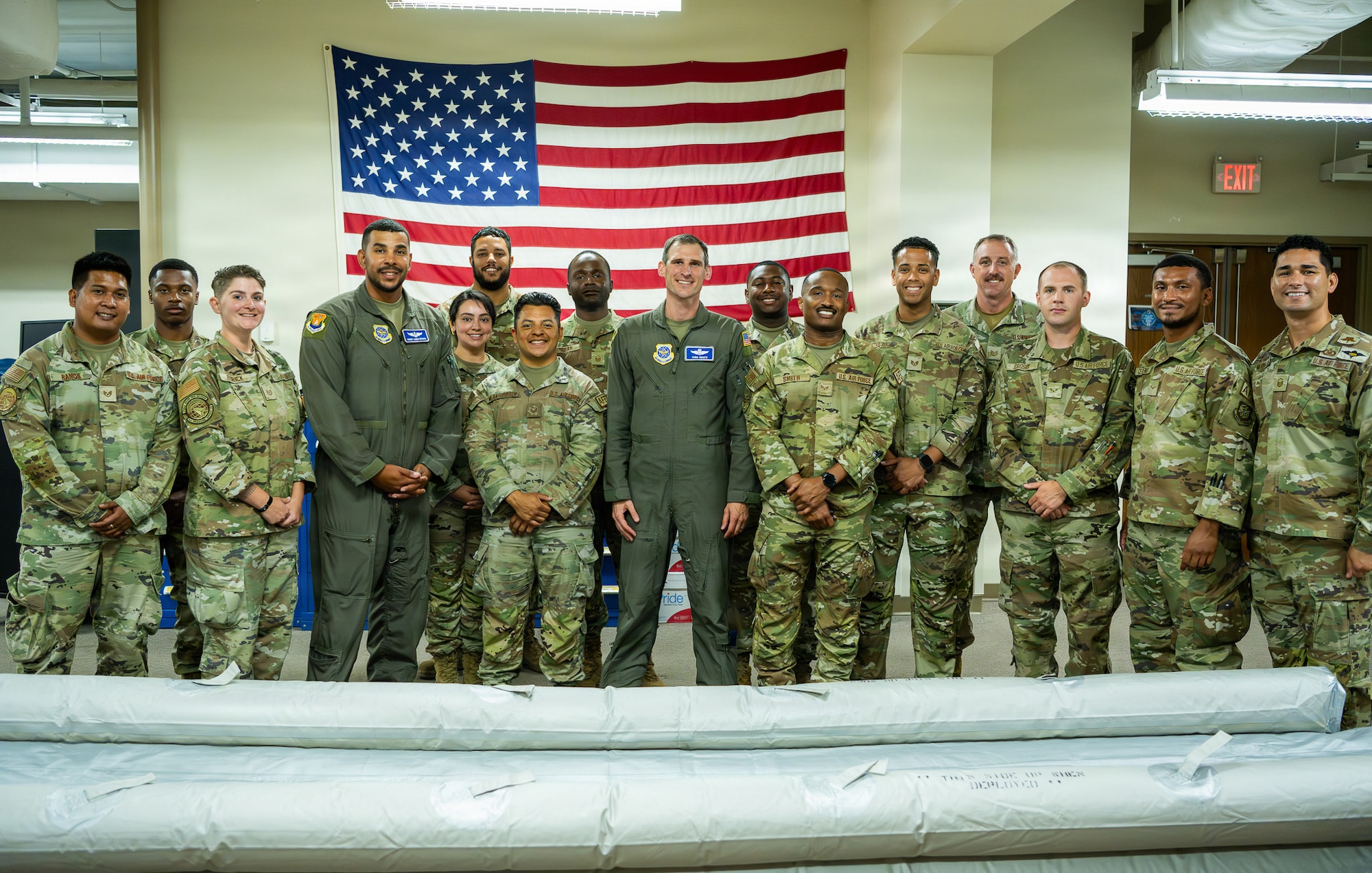 Airmen assigned to the 6th Operation Support Squadron Aircrew Flight Equipment, pose for a group photo at MacDill Air Force Base, Florida, May 19, 2026. The 6th OSS AFE crew maintains and inspects critical flight and survival equipment used by pilots, boom operators and flight doctors to support mission readiness. (U.S. Air Force photo by Airman Micquill Davis)