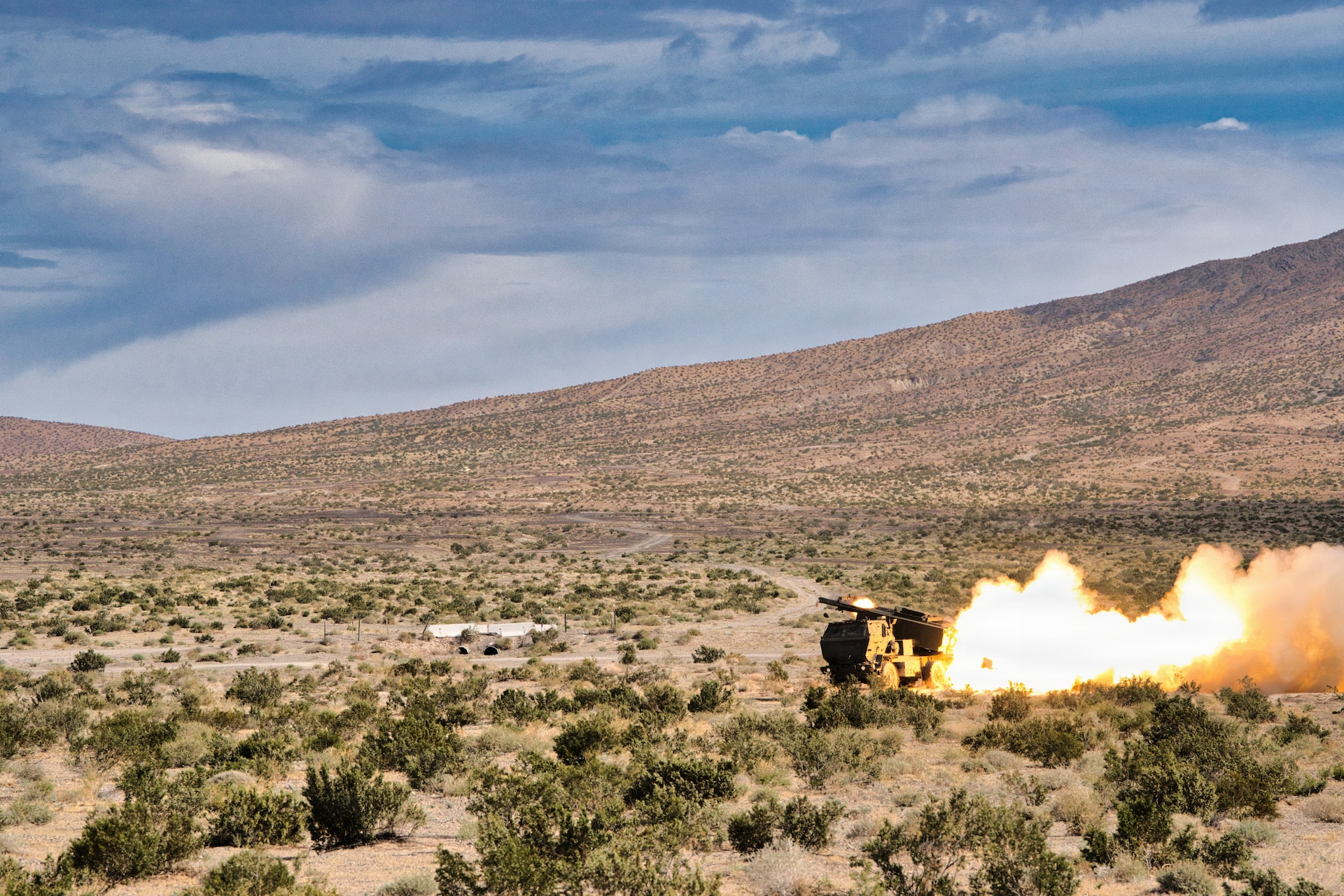 Soldiers of Bravo Battery, 1st Battalion, 623rd Field Artillery conduct live-fire training with a High Mobility Artillery Rocket System (HIMARS) during Exercise Arcane Thunder 26 from Fort Irwin, California while coordinating with Multi-Domain Command - Europe (MDC-E) in Germany, April 25, 2026.