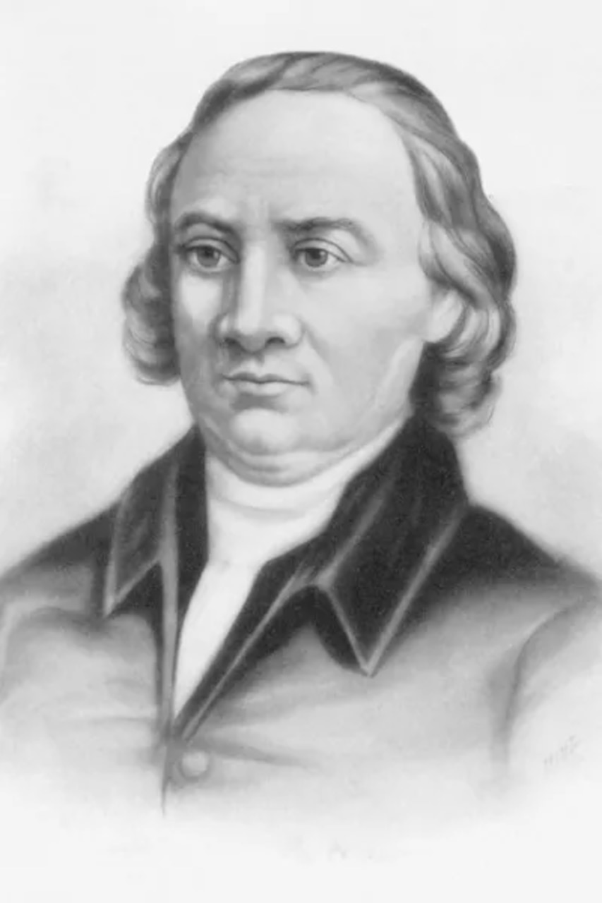 A monochrome image of a man in colonial attire.