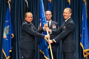 U.S. Air Force Lt. Gen. Linda Hurry, commander of Air Force Materiel Command, passes the guidon to U.S. Air Force Brig. Gen. Douglas Wickert during the Air Force Research Laboratory change of command ceremony at the National Museum of the U.S. Air Force, Wright-Patterson Air Force Base, Ohio, June 3, 2026.