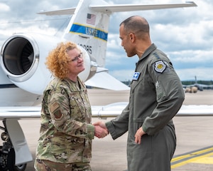 U.S. Air Force Brig. Gen. Adrienne L. Williams, 86th Airlift Wing commander, left, shakes hands with Gen. Adrian Spain, commander of Air Combat Command, at Ramstein Air Base, Germany, May 19, 2026. The visit provided an opportunity for senior leaders to engage directly with Airmen and gain firsthand insight into missions supporting operations and intelligence integration across the European theater. (U.S. Air Force photo by Senior Airman Jared Lovett)