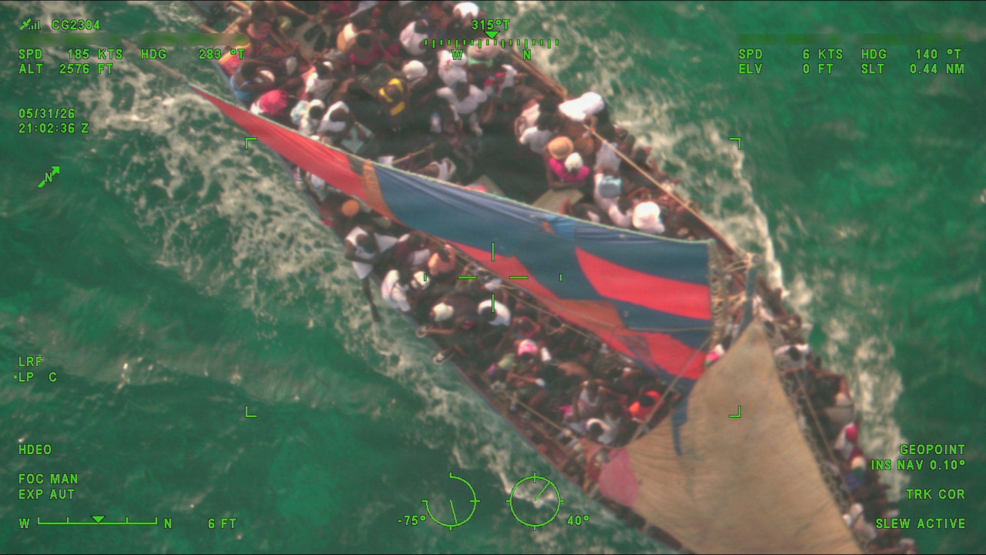 A Coast Guard Air Station Miami 144 aircrew locates an overloaded, unsafe vessel making an unlawful voyage attempt, 15 miles south of the Turks and Caicos Islands, May 31, 2026. U.S Coast Guard, U.S. Customs and Border Protection and the Royal Turks and Caicos Islands Police Force surface and air units interdicted the vessel carrying 240 aliens near Turks and Caicos Islands.(U.S. Coast Guard photo by Air Station Miami).