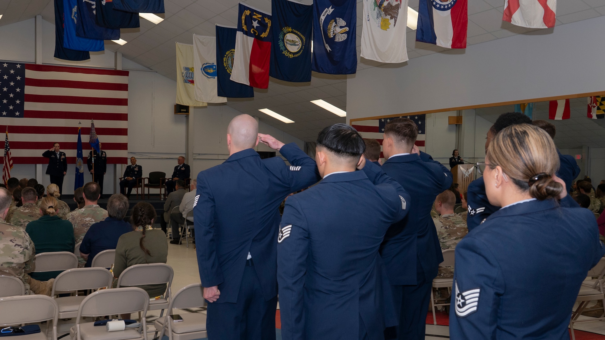 Airmen salute outgoing commander at change of command ceremony.