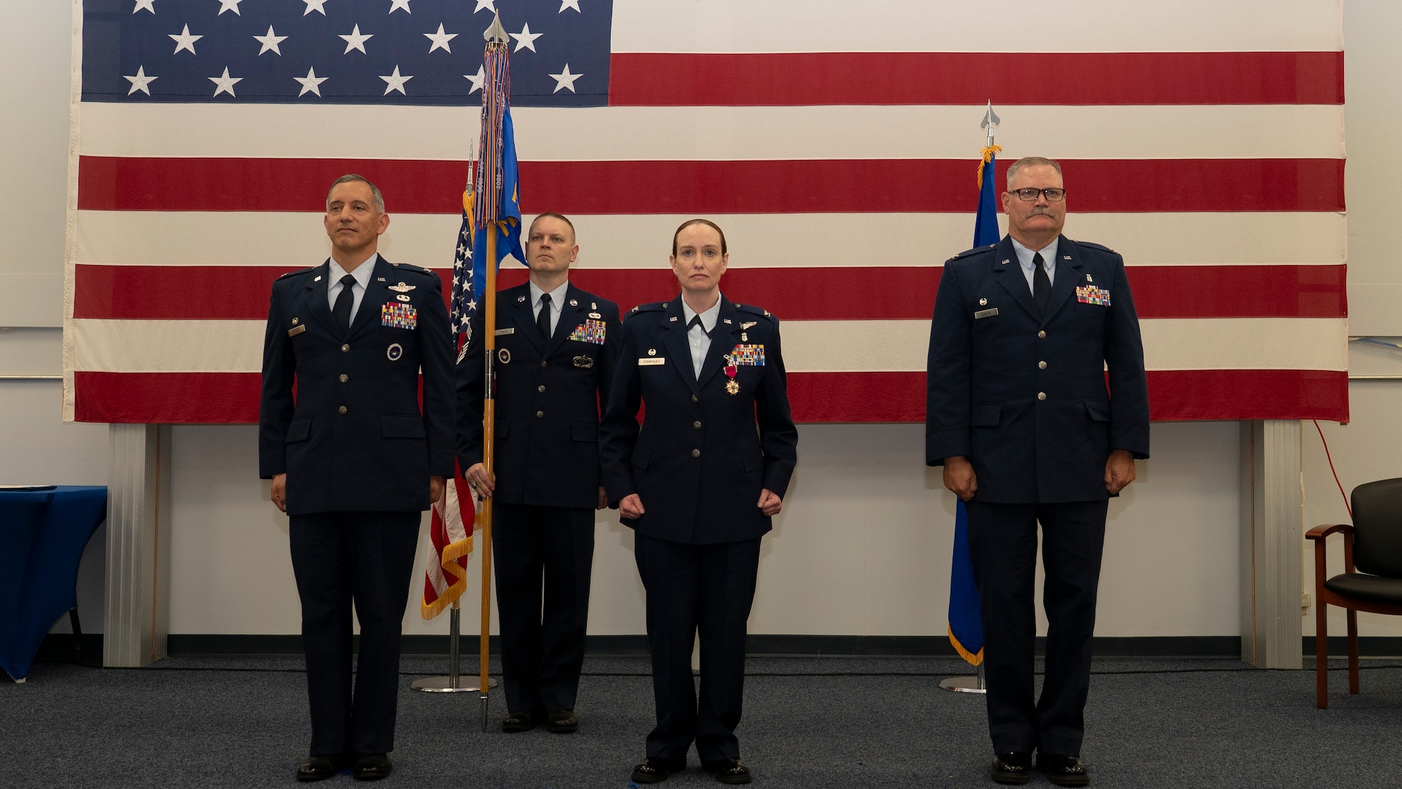 319th Reconnaissance Wing leadership stand at attention