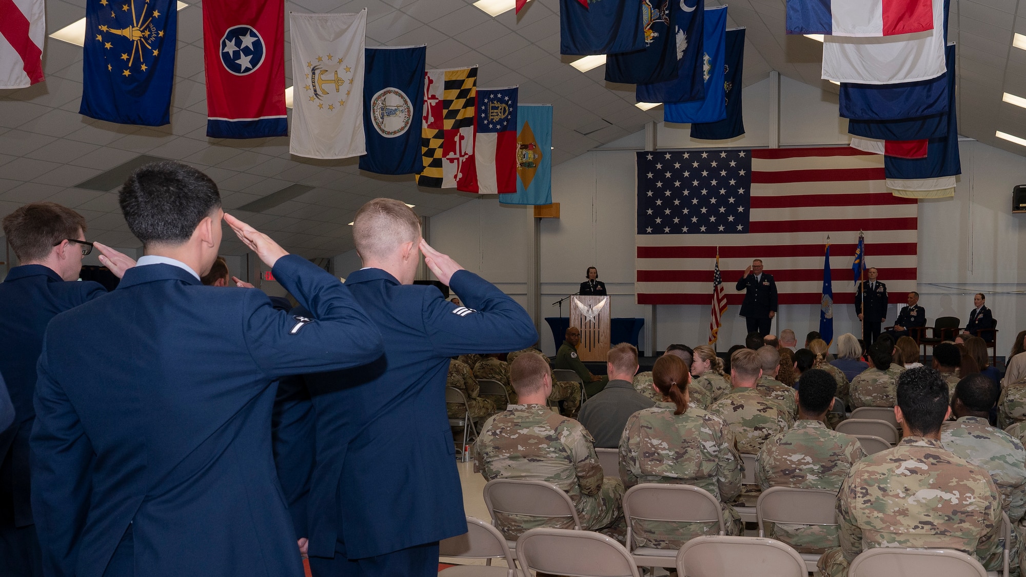 Airmen salute incoming commander
