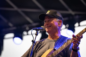 Gary Sinise performs with the Lt. Dan Band at Dover Air Force Base, Delaware, May 20, 2026. Sinise started the Gary Sinise Foundation in 2011 to support wounded veterans, the families of fallen service members, and members of the active-duty, guard and reserve components through fundraising efforts and community events. (U.S. Air Force photo by Airman 1st Class Liberty Kuhn)
