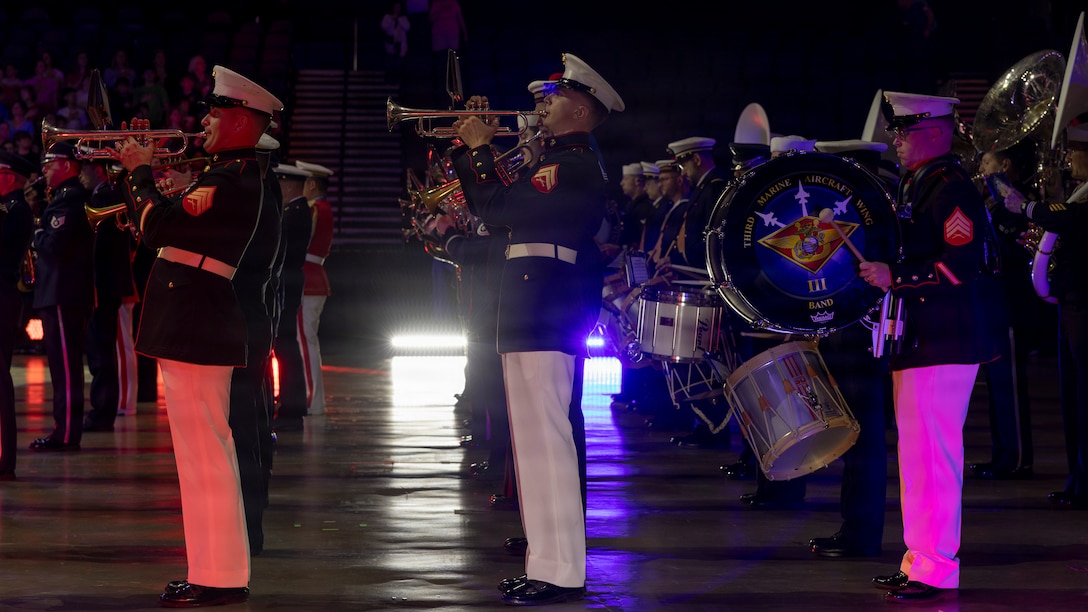 U.S. Marine Corps Sgt. Jacob Stein (left), Cpl. Gregory DeArmond and Sgt. Mark Sherriff, instrumentalists with 3rd Marine Aircraft Wing Band, perform for the opening of the Virginia International Tattoo in Norfolk, Virginia, April 16, 2026. The Virginia International Tattoo is an annual event consisting of performances from military bands, drill teams, dancers and singers from around the world. The event celebrated the alliances between the U.S., the U.K., Canada, France, and South Korea. (U.S. Marine Corps photo by Lance Cpl. Zoey Williams)