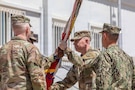 Lt. Gen. Patrick Frank (center), outgoing commander of U.S. Army Central (ARCENT) and Third Army, receives the ARCENT colors from Command Sgt. Maj. Eric McCray, ARCENT senior enlisted advisor, during the ARCENT change of command ceremony June 4 in the Middle East. (U.S. Army photo)