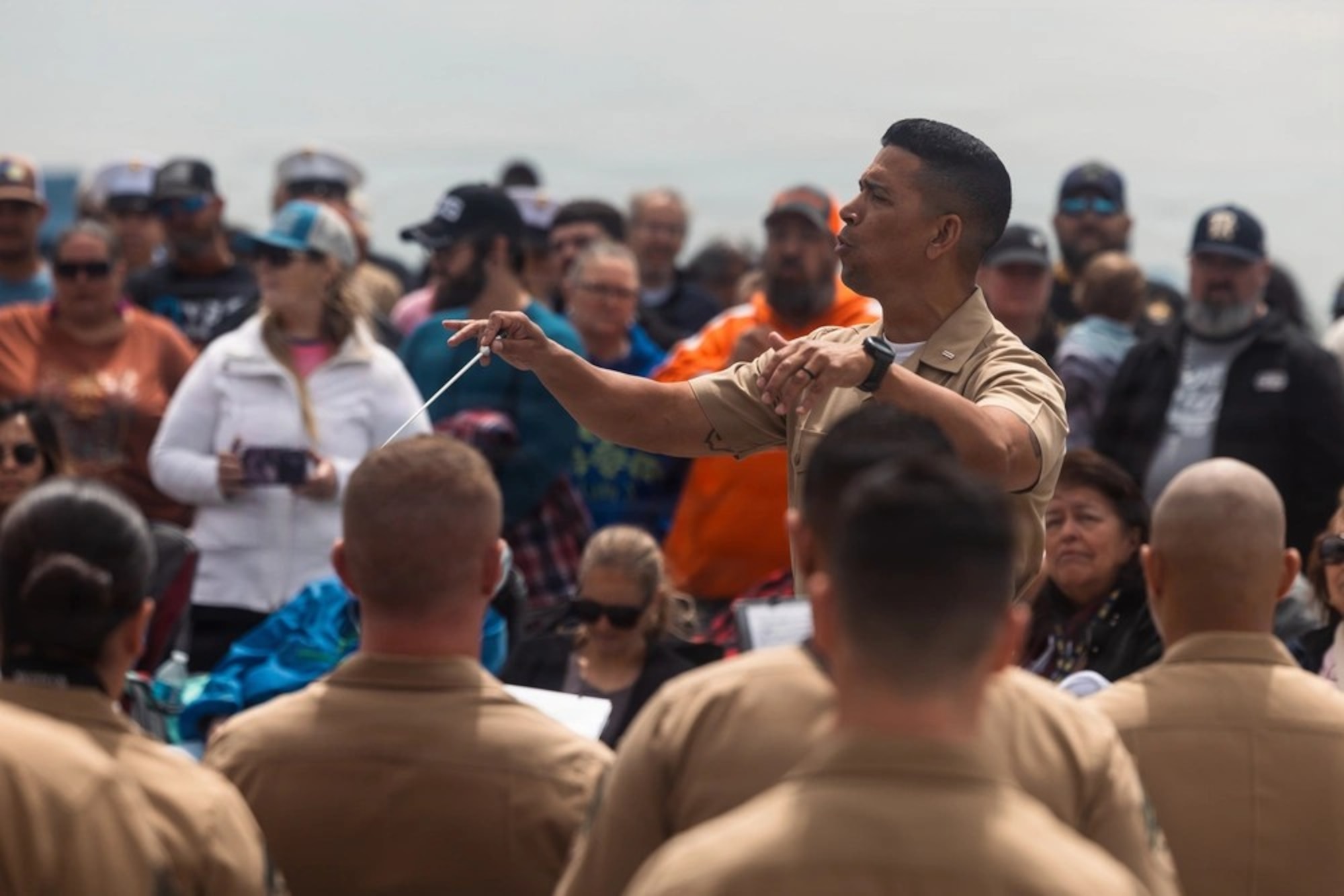 xU.S. Marine Corps Chief Warrant Officer 5 Andres Navarro, the officer in charge of the Quantico Marine Corps Band conducts the QMCB during a performance at Sylvan beach in Houston, Texas, April 19, 2026. Fleet Week is a celebration of the U.S. Navy, Marine Corps, and Coast Guard, typically held in various cities across the United States. It features a parade of Navy and Coast Guard ships, public ship tours, and a variety of events honoring military service, with the city of Houston being the first time in its history hosting the event. (U.S. Marine Corps photo by Cpl. Darien Wright)