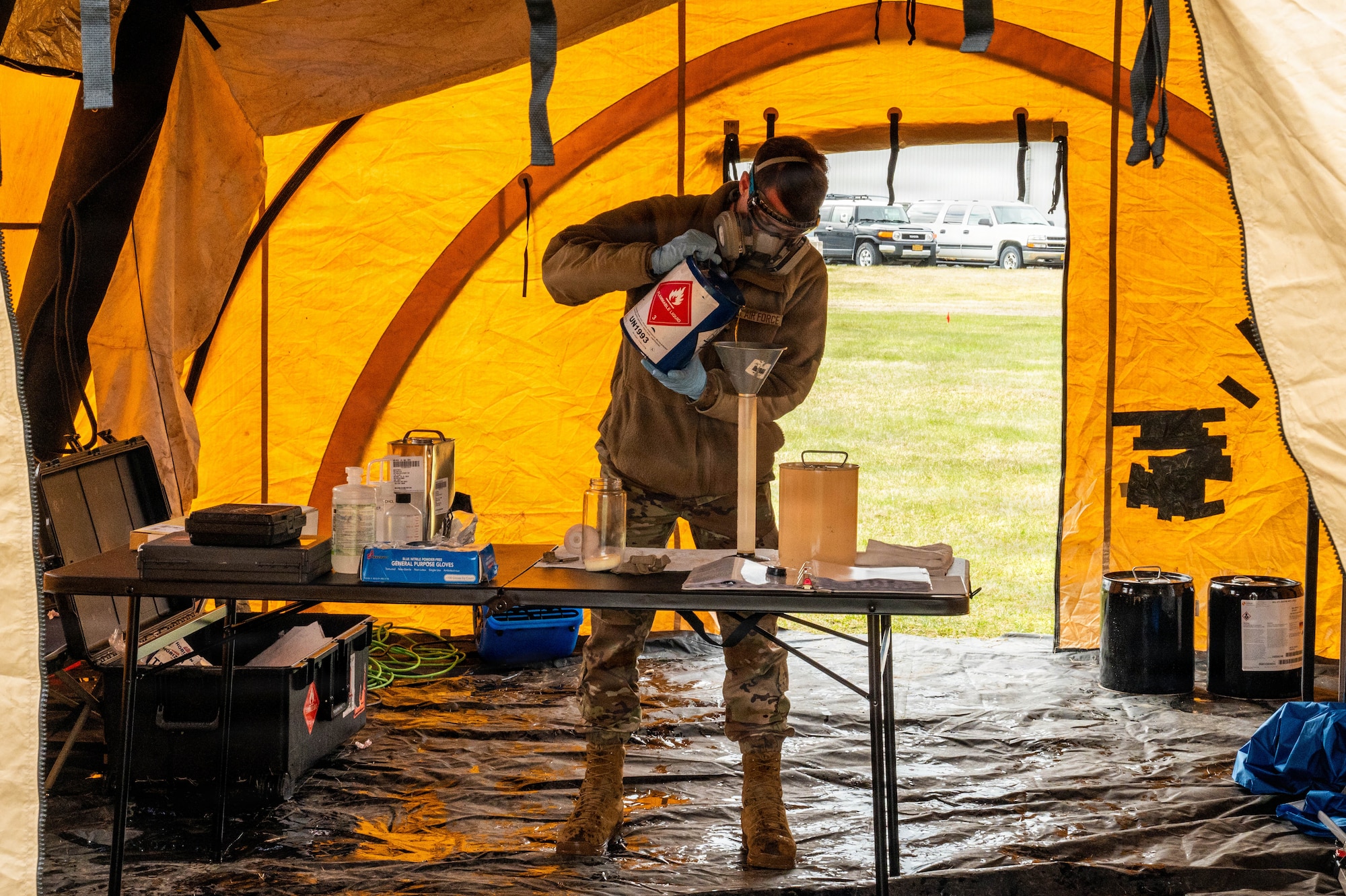 U.S. Air Force Staff Sgt. Sean O’Connor, 673d Logistic Readiness Squadron fuels laboratory noncommissioned officer in charge, mixes fuel components to create Jet Propellant 8 fuel during exercise Tropic Tundra 26 at Kodiak, Alaska, May 13, 2026.