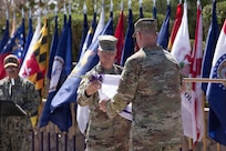 Maj. Gen. Henry S. Dixon, commander, Joint Task Force–North (JTF-N), cases the colors during the JTF-N Casing ceremony at Fort Bliss, Texas, June 3, 2026. The ceremony marks the completion of the organization’s mission in support of NORAD and USNORTHCOM. (U.S. Army photo by Sgt. Treavon Triplett)