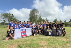 U.S. Army Soldiers assigned to the 101st Airborne Division and the 82nd Airborne Division pose for a group photo following the Remembrance Bowl football game in Normandy, France, June 4, 2026. The annual event, held during D-Day commemorations, honors the legacy and sacrifice of Allied service members who fought during World War II. (U.S. Army photo by Sgt. 1st Class Christopher Osburn)