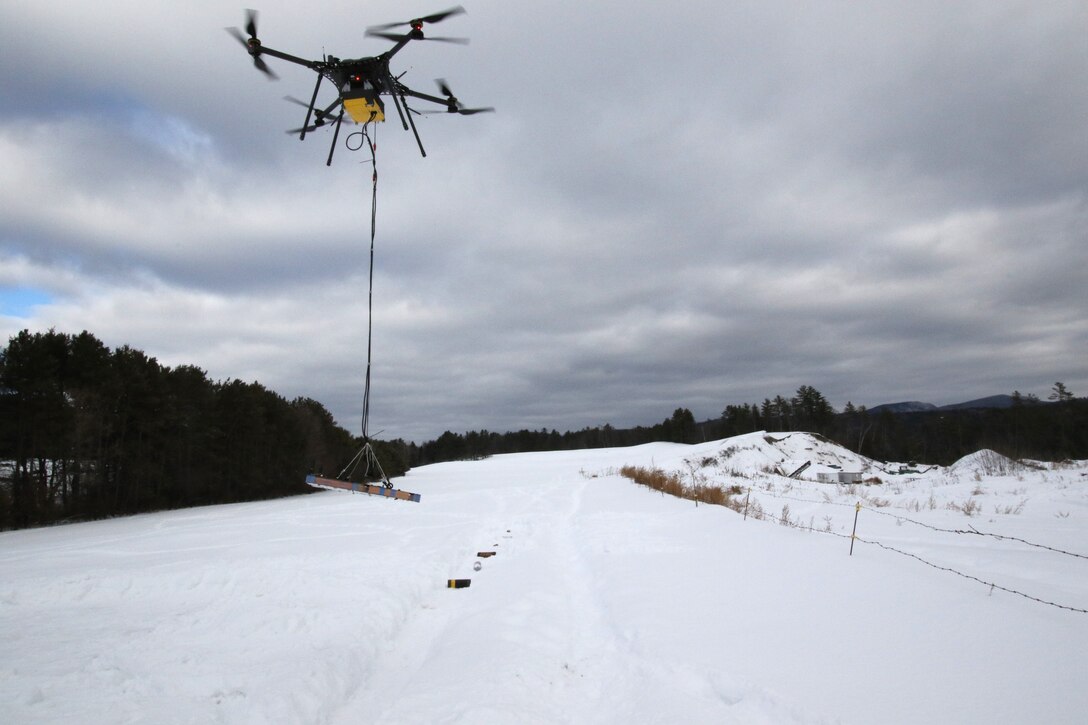 Researchers from the U.S. Army Engineer Research and Development Center’s Cold Regions Research and Engineering Laboratory and Dartmouth College are using drones and electromagnetic induction to find and identify unexploded ordnance.  (U.S. Army Corps of Engineers photo)