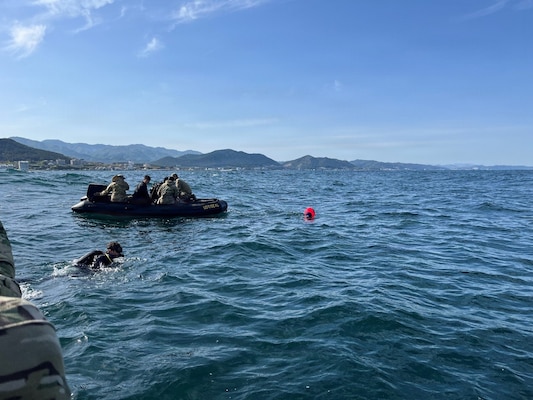 Explosive Ordnance Disposal (EOD) Mobile Unit FIVE Expeditionary Mine Countermeasures Company 3-1 (CTU 77.6) Sailors prepare to conduct joint reacquisition and identification dives alongside Republic of Korea (ROK) divers off the coast of Pohang, South Korea during the 2026 ROK-U.S. Combined Mine Warfare Exercise, April 24, 2026. The 2026 ROK-U.S. Combined Mine Warfare Exercise increases combined proficiency between the Republic of Korea Navy and the U.S. Navy through the exchange of tactics and techniques, while enhancing common bonds. The exercise takes place in U.S. 7th Fleet, the Navy's largest forward-deployed numbered fleet, routinely interacts and operates with allies and partners in preserving a free and open Indo-Pacific. (U.S. Navy photo by Lt. Devon Goetz)