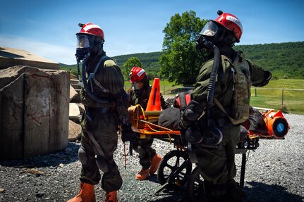 Service members from the New York and New Jersey National Guard Homeland Response Force conduct casualty extraction and hazardous environment response training under the instruction of the West Virginia National Guard during a regional CBRN response exercise. The training focused on lifesaving operations, interagency coordination and rapid response capabilities during large-scale domestic emergencies. (U.S. Army National Guard photo by Sgt. Tristan Murry)