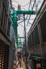 Xavier Thigpen, Huntsville Center project manager, and Jason Bolling, Hale Koa Hotel director of engineering, are photographed inspecting some of the rooftop equpiment.