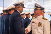 A photo of two men shaking hands.