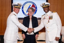 A photo of two men shaking hands.