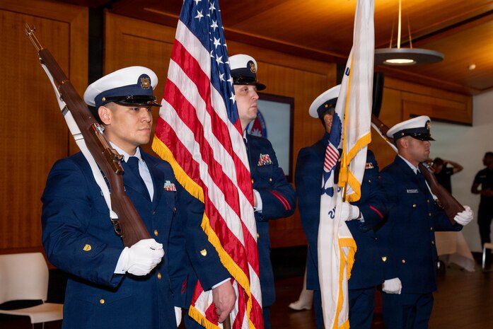 A photo of U.S. Coast Guard Color Guardsmen preparing to present the colors.