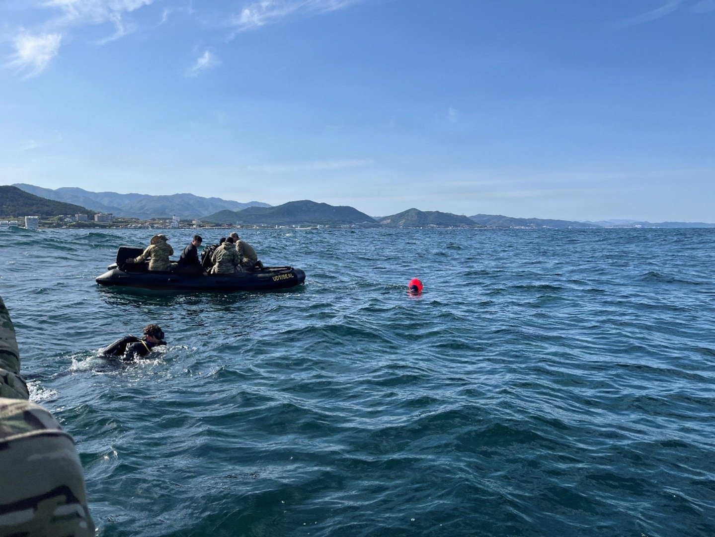 Explosive Ordnance Disposal (EOD) Mobile Unit FIVE Expeditionary Mine Countermeasures Company 3-1 (CTU 77.6) Sailors prepare to conduct joint reacquisition and identification dives alongside Republic of Korea (ROK) divers off the coast of Pohang, South Korea during the 2026 ROK-U.S. Combined Mine Warfare Exercise, April 24, 2026. The 2026 ROK-U.S. Combined Mine Warfare Exercise increases combined proficiency between the Republic of Korea Navy and the U.S. Navy through the exchange of tactics and techniques, while enhancing common bonds. The exercise takes place in U.S. 7th Fleet, the Navy's largest forward-deployed numbered fleet, routinely interacts and operates with allies and partners in preserving a free and open Indo-Pacific. (U.S. Navy photo by Lt. Devon Goetz)