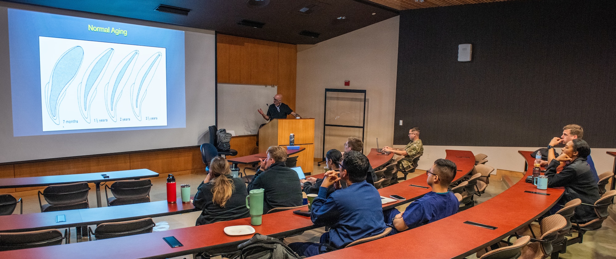 Airmen participate in classroom lecture