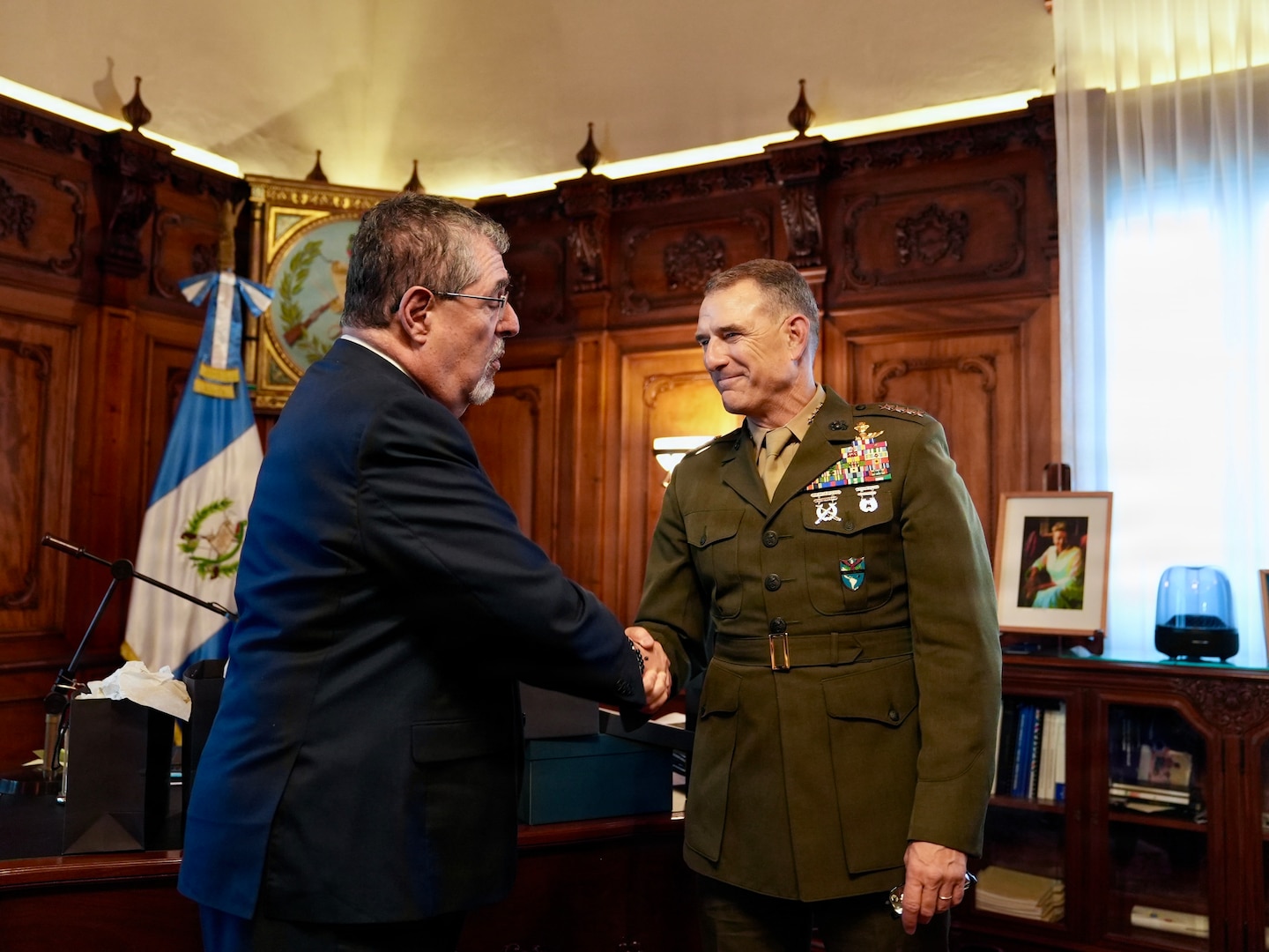 U.S. Marine Corps Gen. Francis L. Donovan, commander of U.S. Southern Command, left, shakes hands with Guatemalan President Bernardo Arévalo, right.