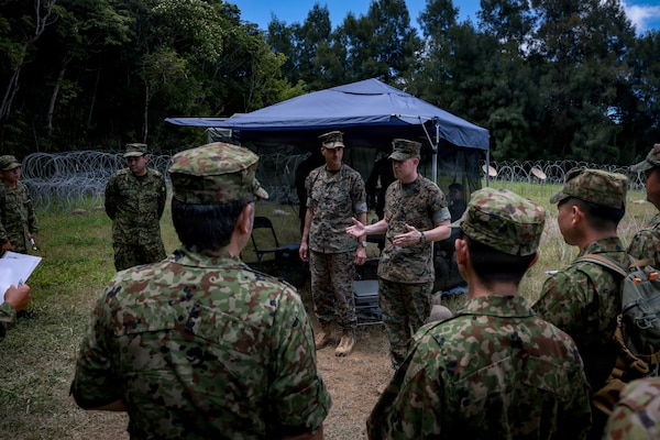 U.S. Marine Corps Sgt. Maj. Steven Toth, a native of Nevada and the sergeant major of 3d Intelligence Battalion, III Marine Expeditionary Force Information Group, briefs Japan Ground Self-Defense Force soldiers during Kaiju Rain 26 at Camp Hansen, Okinawa, Japan, May 20, 2026.