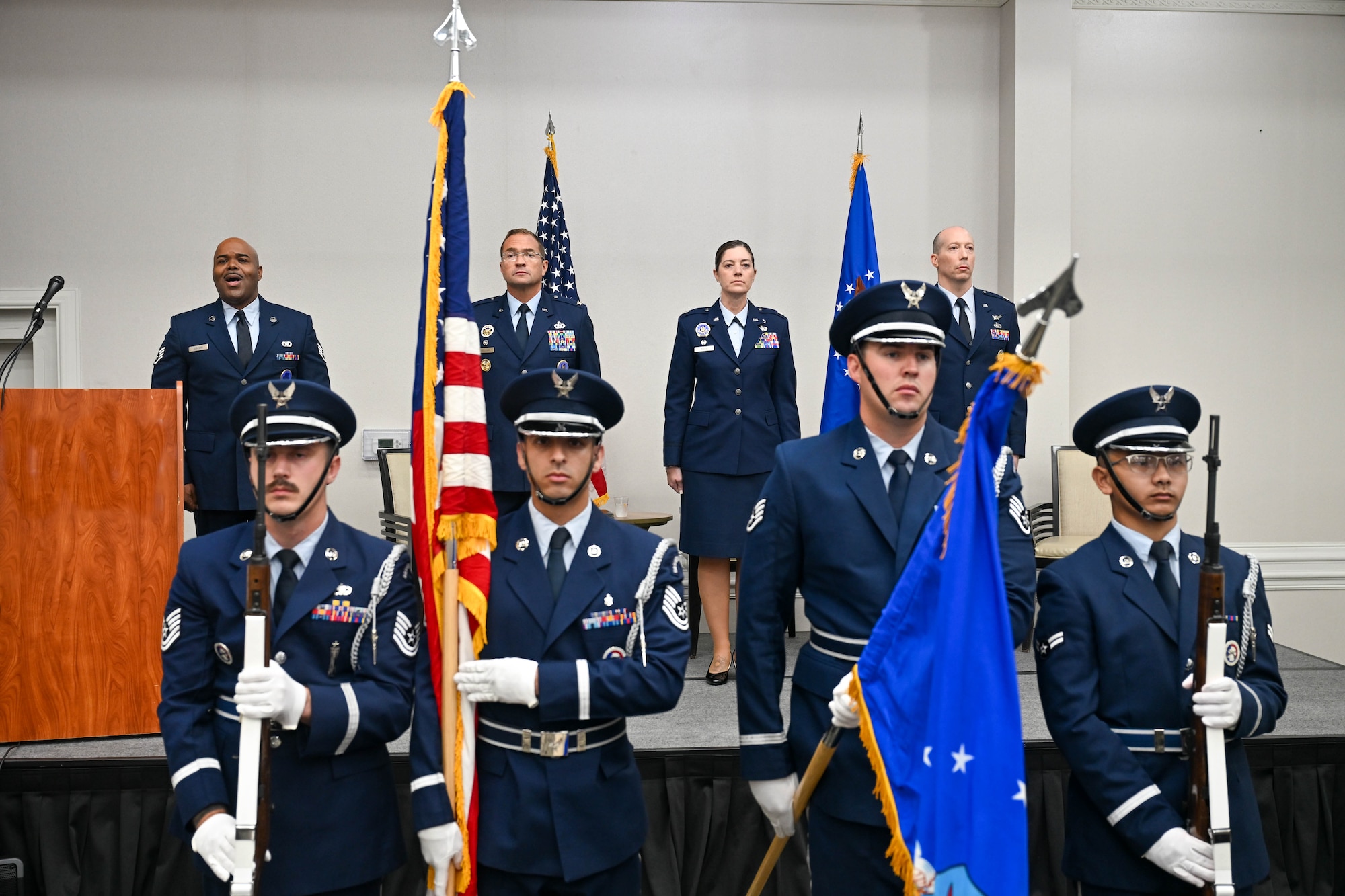 (From Left) Staff Sgt. Jamaal Dunham, enlisted accessions recruiter, 351st Recruiting Squadron, headquartered at Dobbins Air Reserve Base, Marietta, Georgia, sings the National Anthem as U.S. Air Force Col. Sean “Metro” Fellows, 367th Recruiting Group commander, Robins Air Force Base, Georgia, U.S. Air Force Lt. Col. Micah Bluto, 351 RCS outgoing commander, U.S. Air Force Lt. Col. Jonathan L. Markley, 351 RCS incoming commander, and the Honor Guard from Homestead Air Force Base, Florida, stand at attention during a Change of Command ceremony, June 4, 2026, Orlando, Florida. A Change of Command is a formal military procedure where an incoming officer formally accepts the official authority, responsibility, and accountability of a unit. (U.S. Air Force photo by Master Sgt. Della Creech)