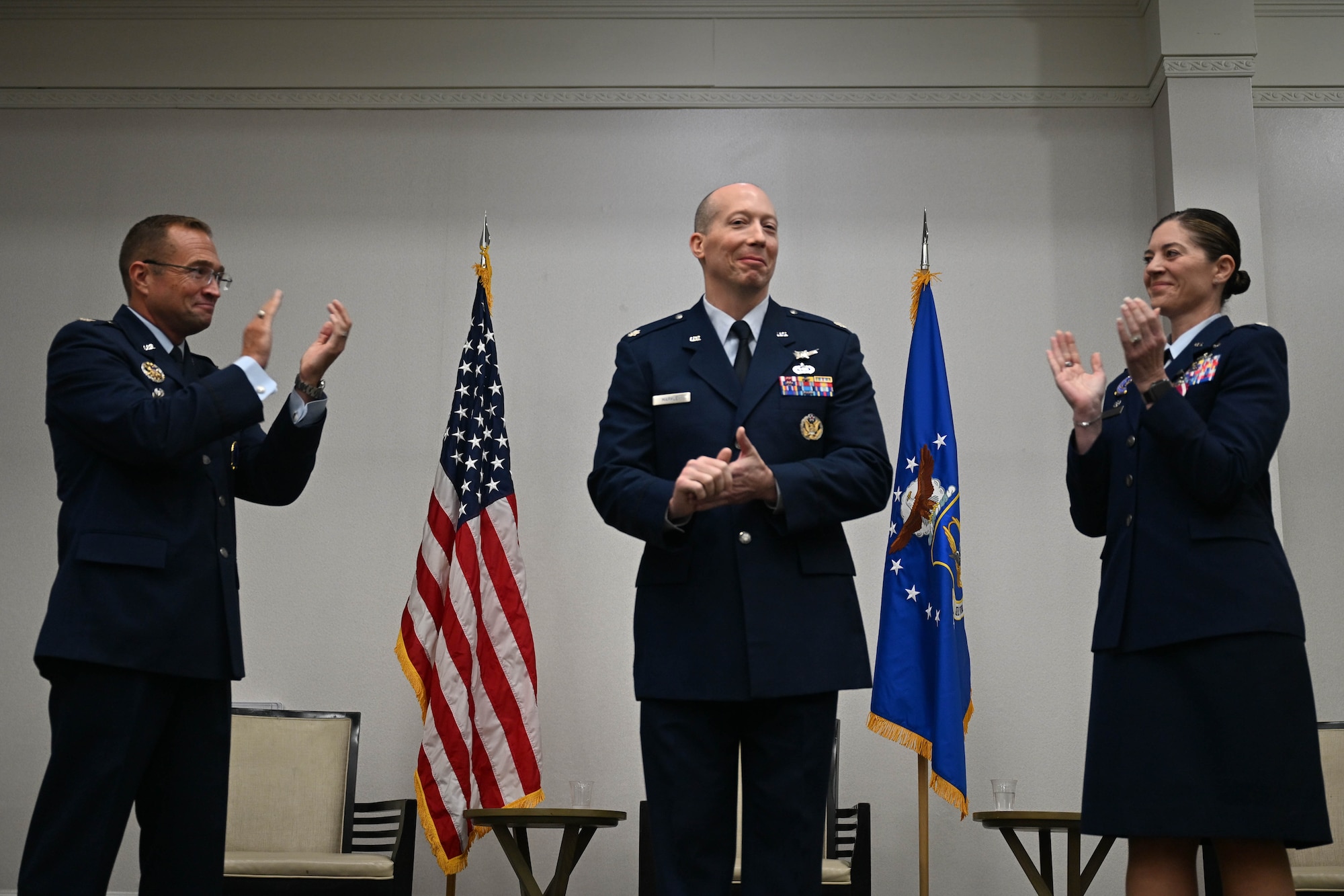 U.S. Air Force Col. Sean “Metro” Fellows, 367th Recruiting Group commander, Robins Air Force Base, Georgia, and U.S. Air Force Lt. Col. Micah Bluto, 351st Recruiting Squadron outgoing commander, headquartered at Dobbins Air Reserve Base, Marietta, Georgia, cheer on incoming commmander, U.S. Air Force Lt. Col. Jonathan L. Markley, 351 RCS incoming commander, during a Change of Command ceremony, June 4, 2026, Orlando, Florida. A Change of Command is a formal military procedure where an incoming officer formally accepts the official authority, responsibility, and accountability of a unit. (U.S. Air Force photo by Master Sgt. Della Creech)