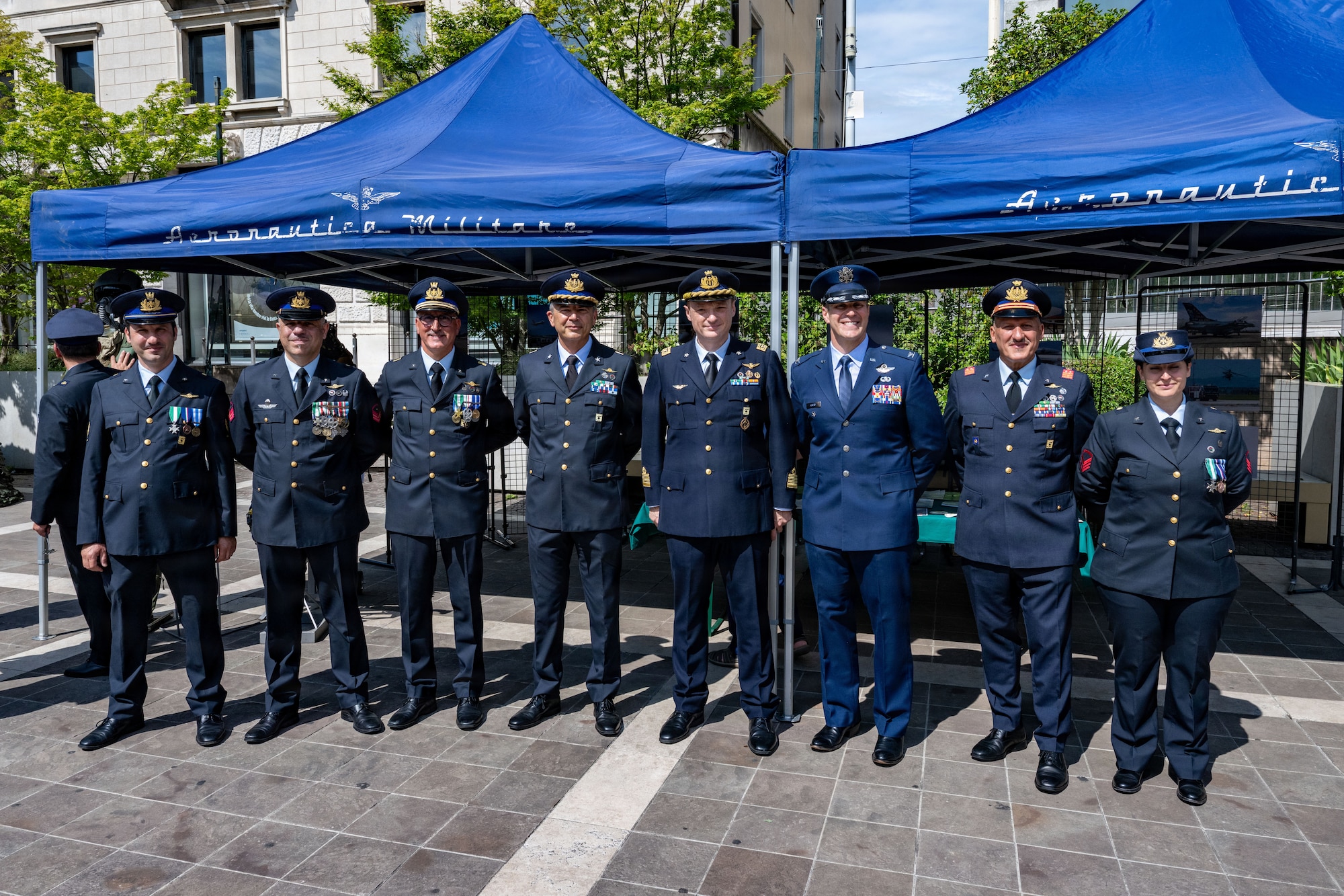 Men in military uniform stand together for a photo