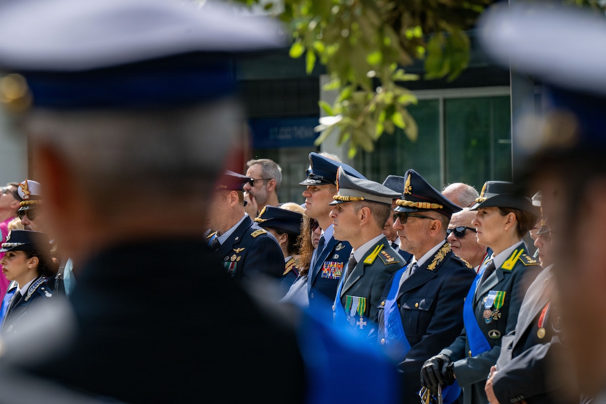 Men in military uniform stand together