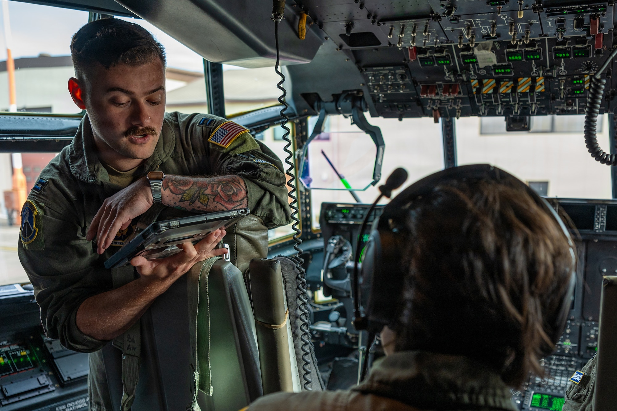 A photo of an Airman in a cockpit