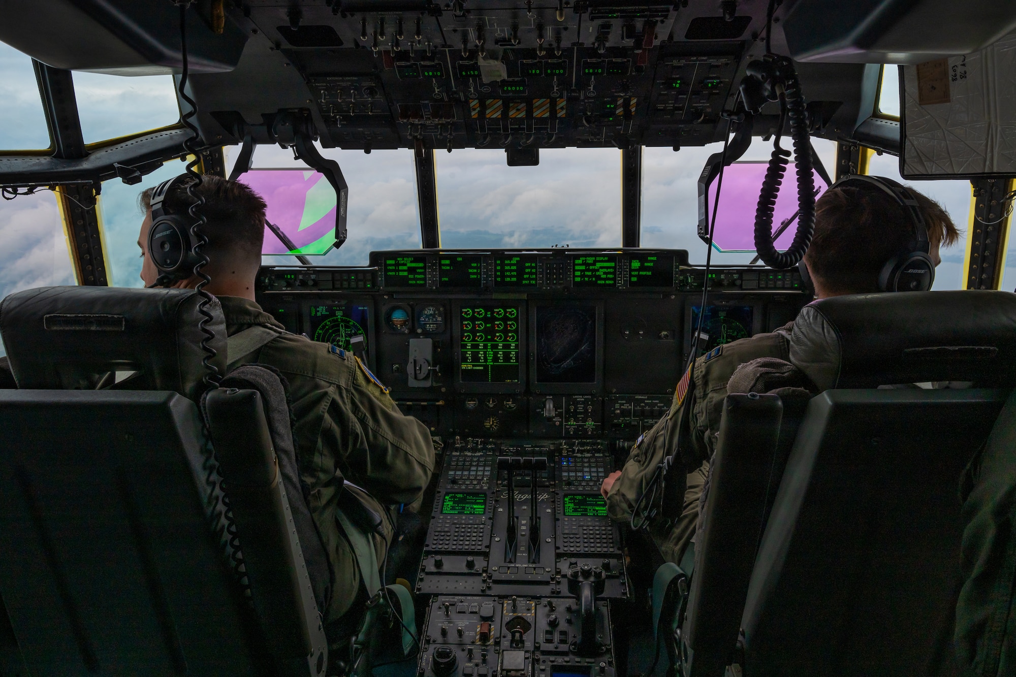 A photo of Airmen in a cockpit