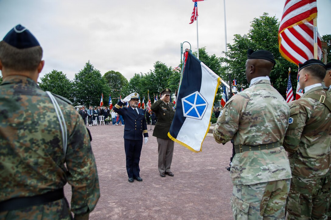 U.S. Army Lt. Gen. Mark Landes, commanding general for First Army, renders a salute with his French Naval Officer counterpart to the French, German, and U.S. Color Guard in a ceremony of remembrance of Gen. Dwight Eisenhower, 34th U.S. President, in Sainte-Mere-Eglise, France, June 3, 2026. U.S. service members assigned to units throughout Europe and the U.S. will participate in over 120 events and ceremonies June 2-7, to commemorate the 82nd anniversary of D-Day in the Normandy region of France. (U.S. Army photo by Sgt. 1st Class Brenden Delgado)