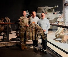 U.S. Army Maj. Gen. David Gardner, left, commanding general of the 101st Airborne Division (Air Assault), stands with Emmanuel Allain, center, and Michel De Trez, co-directors of the D-Day Experience Museum, following a uniform donation ceremony honoring the 82nd anniversary of D-Day in Normandy, France, June 2, 2026. The event serves to honor the past while educating future generations on the sacrifices made during WWII.