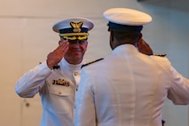 The incoming commander salutes to the outgoing commander.
