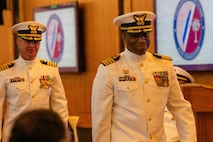 The incoming and outgoing commanders walk to conduct a crew inspection.