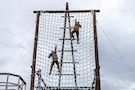 Regional partners and U.S. Army Soldiers complete the rope ladder obstacle known as "The Tough One" during confidence training at Fort Harrison, Montana, June 1, 2026, as part of exercise Regional Cooperation 2026. Regional Cooperation 2026 is an annual, multinational U.S. Central Command-sponsored command-post, field training and cyber defense exercise conducted by U.S. National Guard units in partnership with nations from Central and South Asia. (U.S. Army National Guard photo by Spc. Ishmael Perin and Spc. Daniel Temme)