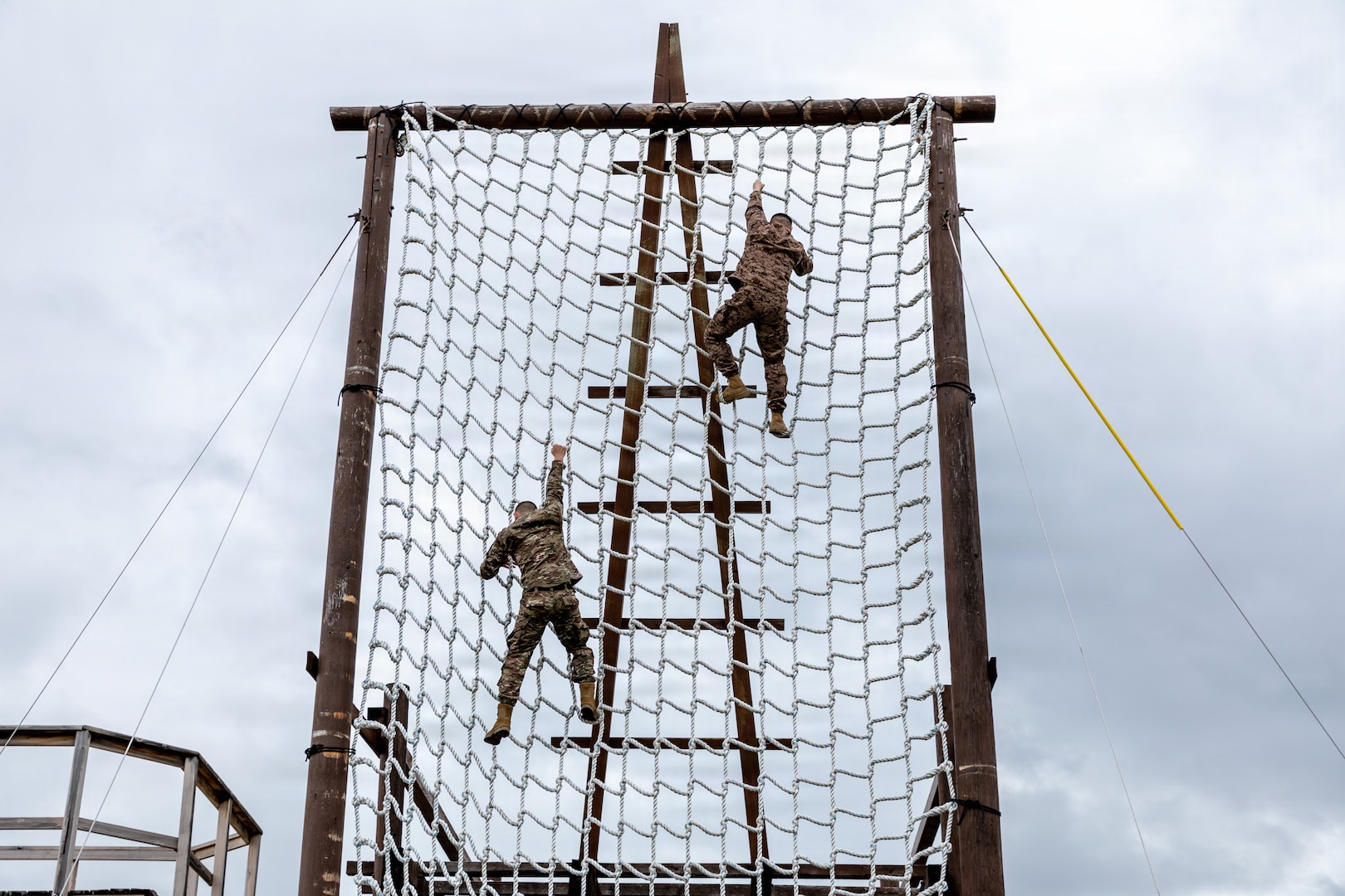 Regional partners and U.S. Army Soldiers complete the rope ladder obstacle known as "The Tough One" during confidence training at Fort Harrison, Montana, June 1, 2026, as part of exercise Regional Cooperation 2026. Regional Cooperation 2026 is an annual, multinational U.S. Central Command-sponsored command-post, field training and cyber defense exercise conducted by U.S. National Guard units in partnership with nations from Central and South Asia. (U.S. Army National Guard photo by Spc. Ishmael Perin and Spc. Daniel Temme)