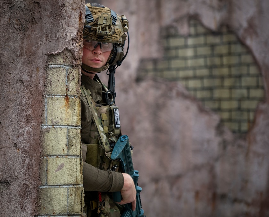 Senior Airman Travis Huffman, an explosive ordnance disposal technician assigned to the 92nd Civil Engineer Squadron, observes his team maneuver during the 96th Test Wing-hosted Explosive Ordnance Disposal Warfighter event at Eglin Air Force Base, Fla., May 6, 2026. The two-week exercise focused on current challenges and mission-relevant training for the explosive ordnance disposal career field. (U.S. Air Force photo by Samuel King Jr.)