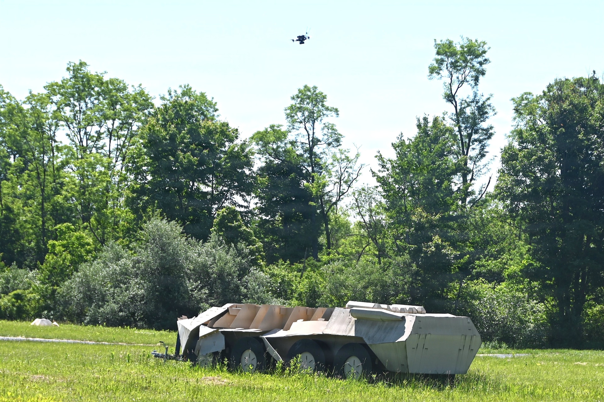 A Neros Archer first-person-view drone hovers above a simulated military vehicle during new equipment training at the Fort Indiantown Gap Unmanned Aircraft System Training and Innovation Facility June 3, 2026, at Fort Indiantown Gap, Pennsylvania. The Archer is the first of eight drones the Soldiers at the TIF will receive training on so that they can train other Soldiers as part of the Department of War’s Drone Dominance Program. (Pennsylvania National Guard photo by Brad Rhen)