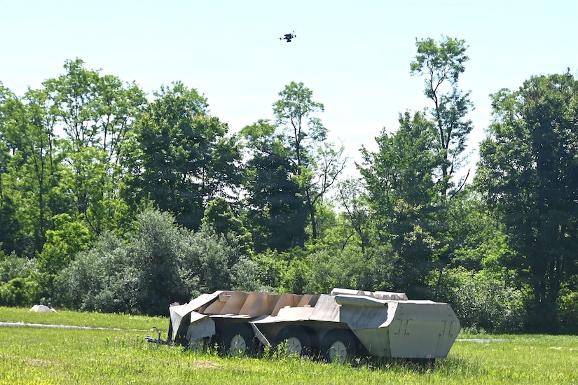 A Neros Archer first-person-view drone hovers above a simulated military vehicle during new equipment training at the Fort Indiantown Gap Unmanned Aircraft System Training and Innovation Facility June 3, 2026, at Fort Indiantown Gap, Pennsylvania. The Archer is the first of eight drones the Soldiers at the TIF will receive training on so that they can train other Soldiers as part of the Department of War’s Drone Dominance Program. (Pennsylvania National Guard photo by Brad Rhen)