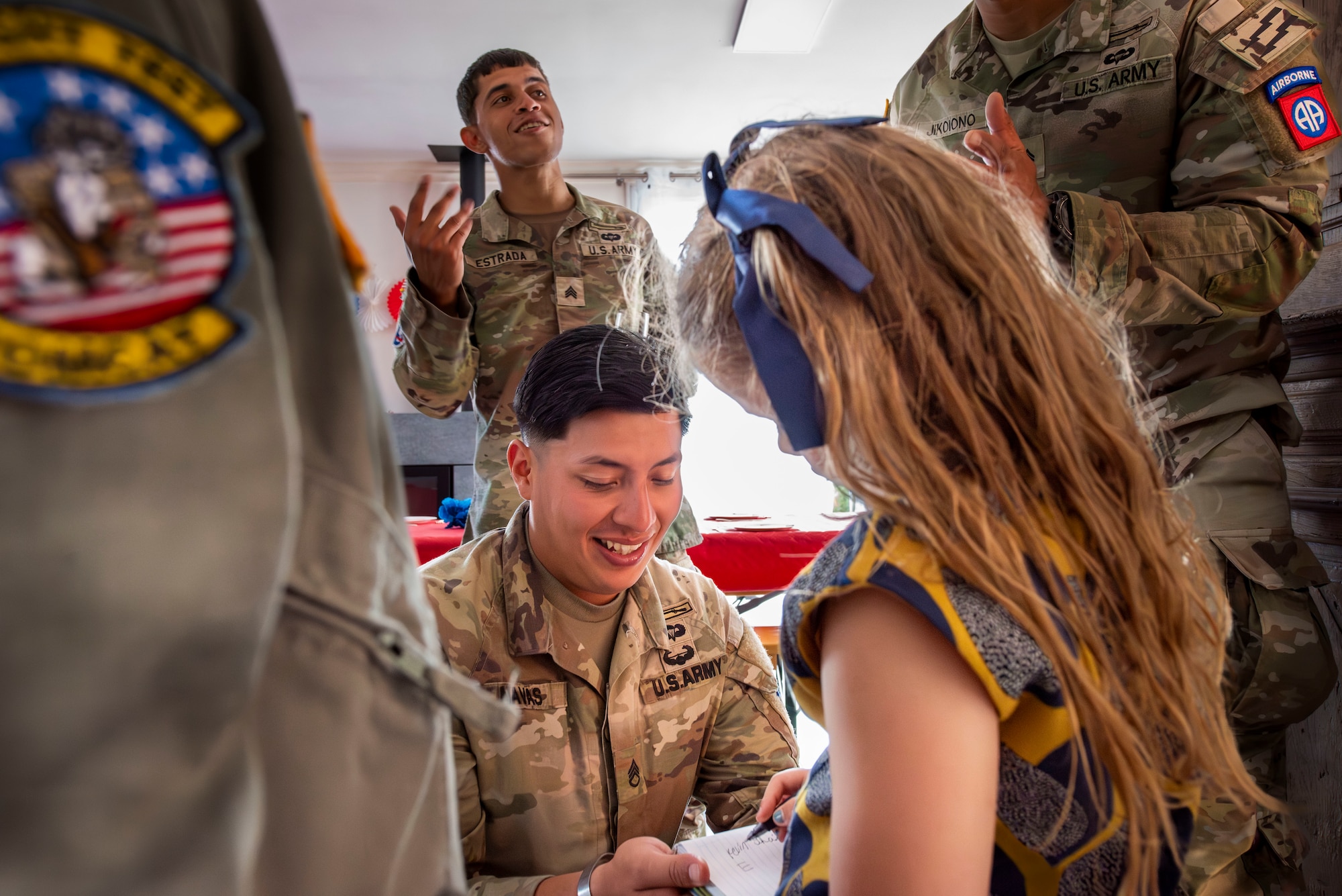 A solider greeting a little girl