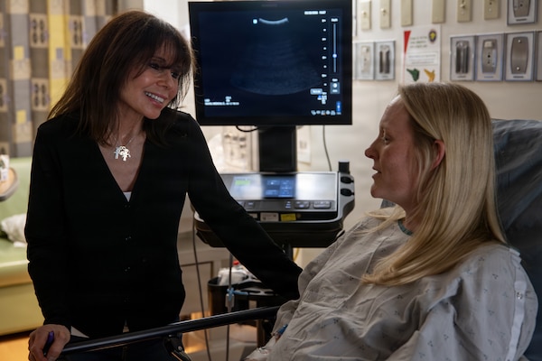 Heidi Murkoff, author of the “What to Expect When You’re Expecting” series of pregnancy guides, engages in conversation with U.S. Navy veteran Julia Baily, at Naval Medical Center San Diego, May 28. Murkoff signed autographs and handed out copies of her books to staff and patients during a visit to NMCSD. NMCSD employs more than 5,500 active-duty military personnel, civilians, and contractors in Southern California to deliver exceptional care afloat and ashore. (U.S. Navy photo by Mass Communication Specialist 3rd Class Jason Afable)