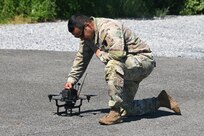 A Soldier prepares a Neros Archer first-person-view drone for flight during new equipment training at the Fort Indiantown Gap Unmanned Aircraft System Training and Innovation Facility June 3, 2026, at Fort Indiantown Gap, Pennsylvania. The Archer is the first of eight drones the Soldiers at the TIF will receive training on so that they can train other Soldiers as part of the Department of War’s Drone Dominance Program. (Pennsylvania National Guard photo by Brad Rhen)