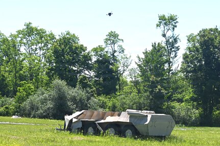 A Neros Archer first-person-view drone hovers above a simulated military vehicle during new equipment training at the Fort Indiantown Gap Unmanned Aircraft System Training and Innovation Facility June 3, 2026, at Fort Indiantown Gap, Pennsylvania. The Archer is the first of eight drones the Soldiers at the TIF will receive training on so that they can train other Soldiers as part of the Department of War’s Drone Dominance Program. (Pennsylvania National Guard photo by Brad Rhen)